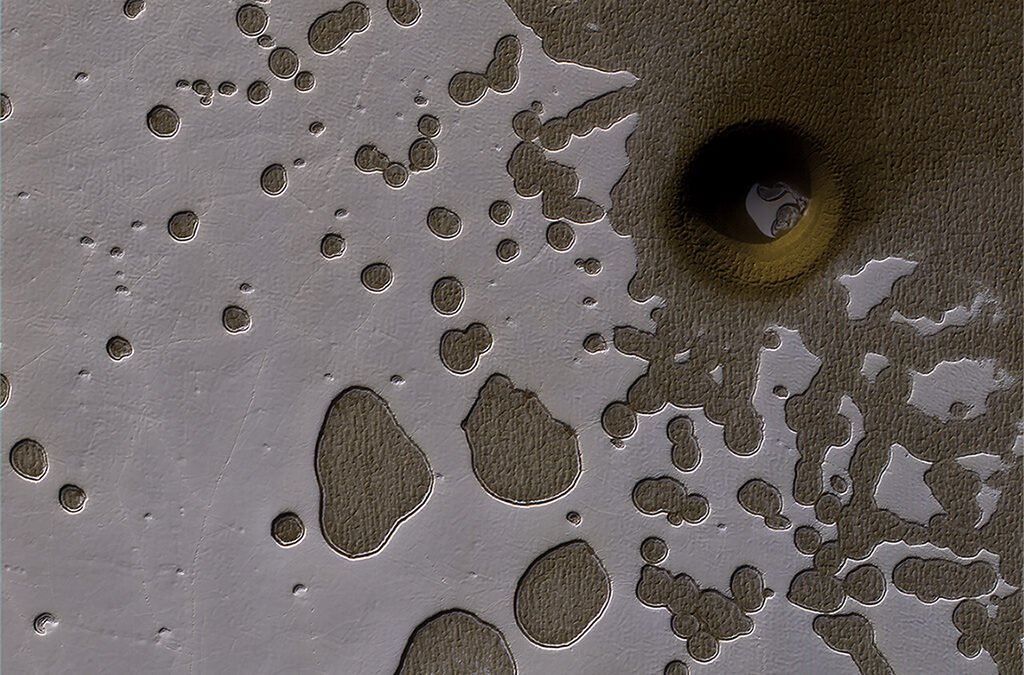 Mars Has Bizarre “Swiss Cheese” Terrain. You can Thank Water, Carbon Dioxide and 500,000 years of Climate History for That
