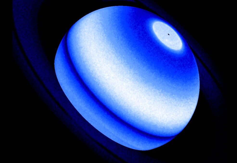 Saturn’s Rings Warm Up its Atmosphere