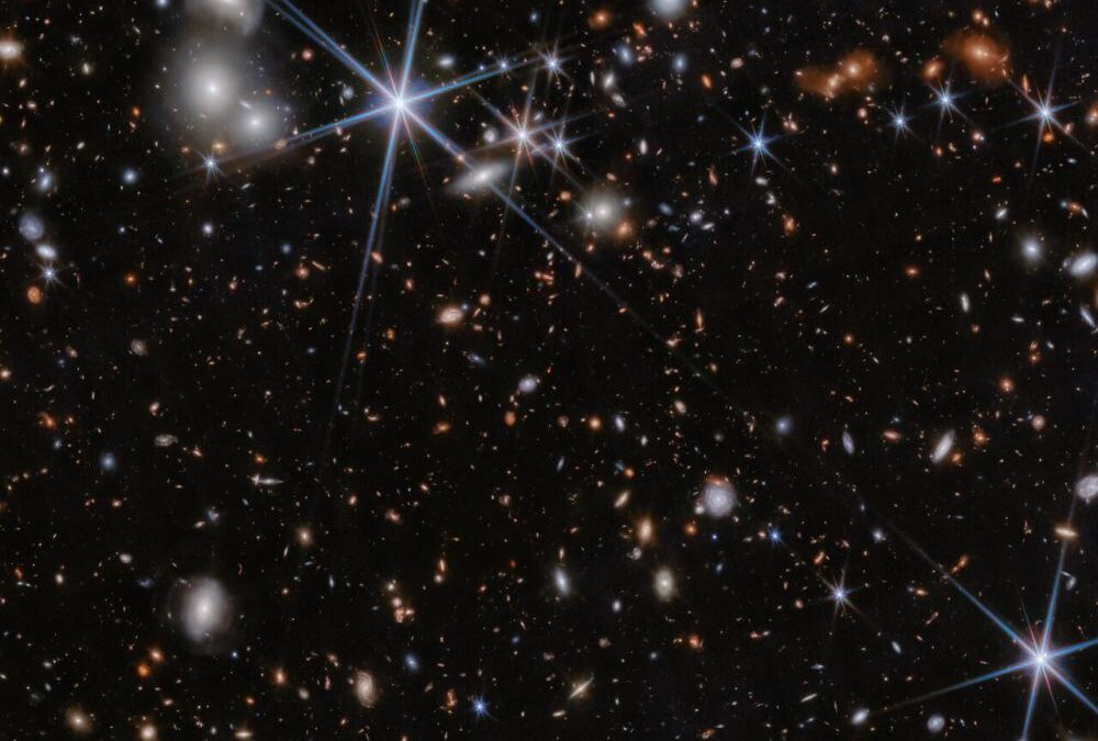 Webb Sees Black Holes Merging Near the Beginning of Time